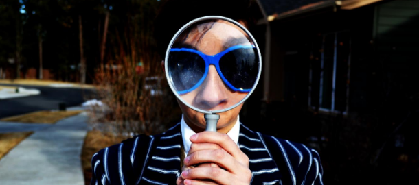 women looking into magnifying glass